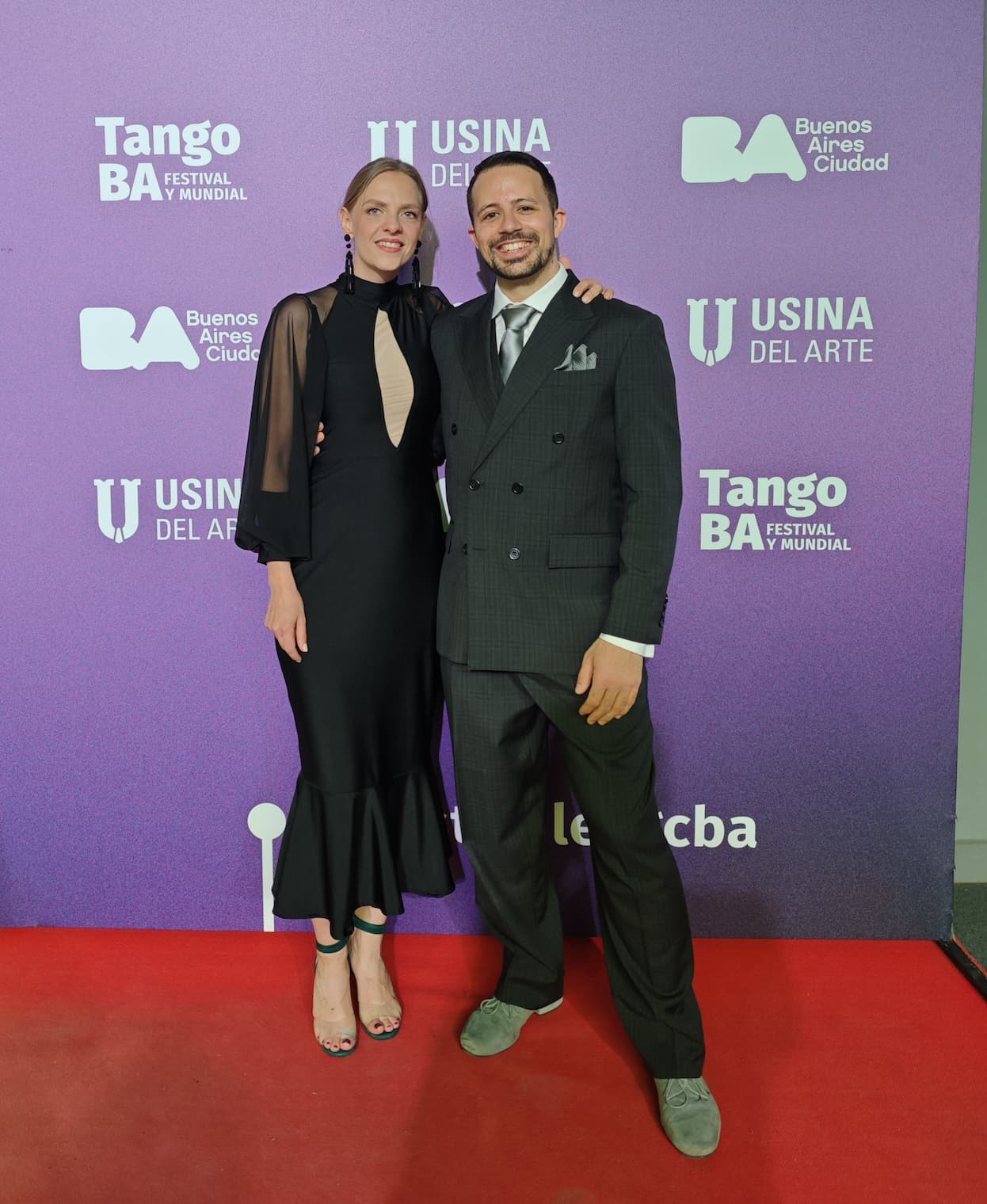 Juliana and Fadi after the Mundial de Tango, elegantly dressed in a suit and dress